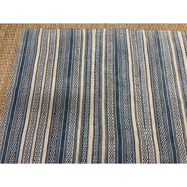Vintage light weight Kilim fabric fragment in tan and denim blue stipe. Panels of stirpes sewn together to form this...