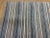 Vintage light weight Kilim fabric fragment in tan and denim blue stipe. Panels of stirpes sewn together to form this...