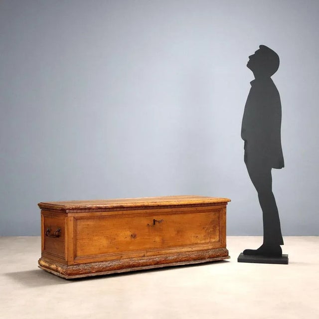 Walnut chest, paneled front and sides, wrought iron handles. Italy, 18th century. This piece is attributed to the...