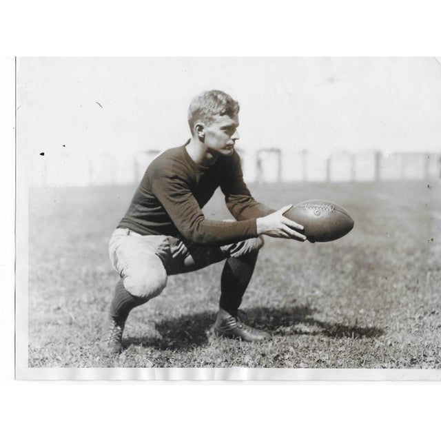 1930 photo of Harvard University quarterback Eliot Putnam. Publication information is adhered to the back.