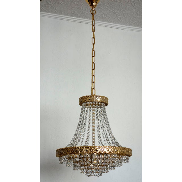 Crystal and 24k Gold Plated Chandelier from Sölken Leuchten, 1970s, in Very Good conditions. Designed 1970 to 1979 This...
