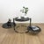 This stunning sculptural coffee table with three rotating black glass tops is designed to be both functional and visually...