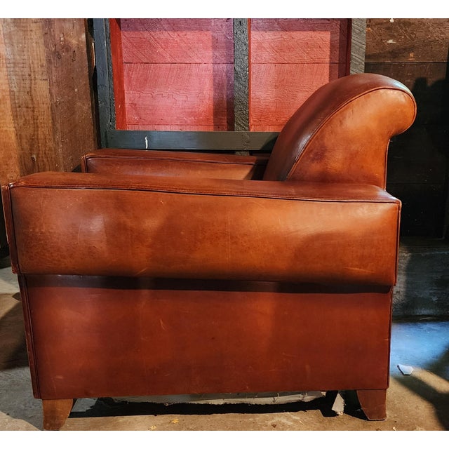 Beautiful French Club Chair with and rich cognac/whiskey leather, which has developed a beautiful natural patina over...