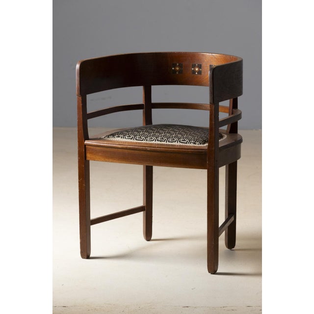 Refined Central European armchair dating from the early decades of the 20th century, distinguished by its elegant curved...