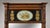 A tall wooden pier mirror featuring twist-turned side columns and a classical architectural cornice at the top. The upper...