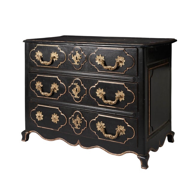 Louis XIV black and gold painted commode features beautiful hardware and wood detailing. Made in the 18th century.
