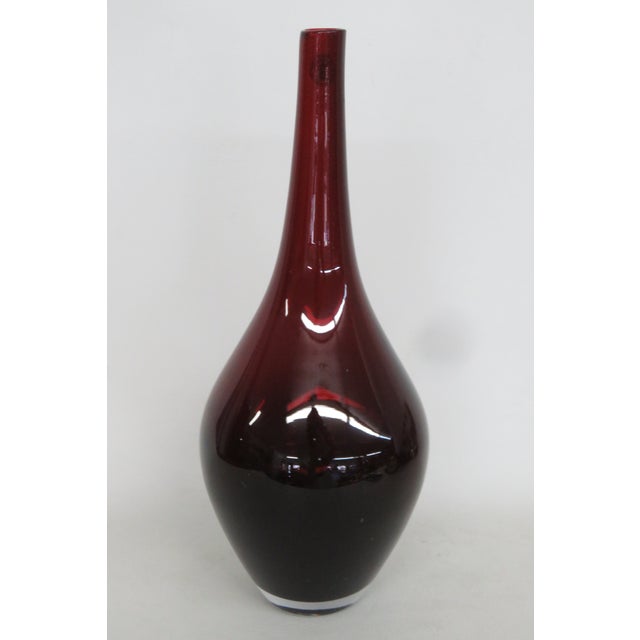 This lovely Teardrop Bulb Vase is made of art glass. This lovely vase has a beautiful ruby red color to the glass and a...