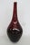 This lovely Teardrop Bulb Vase is made of art glass. This lovely vase has a beautiful ruby red color to the glass and a...