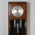 An Art Deco burr and figured walnut Longcase Clock. Eight day movement with quarter hour Westminster chimes. Dimensions: H...