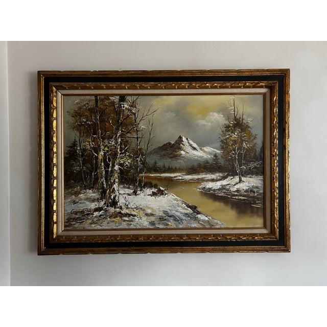 Large, vintage original landscape oil painting on canvas of snow covered mountains. In original black and gold carved wood...