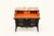 A dramatic Louis XV-style bombé commode presented in a sophisticated charcoal finish. Its curved silhouette is...