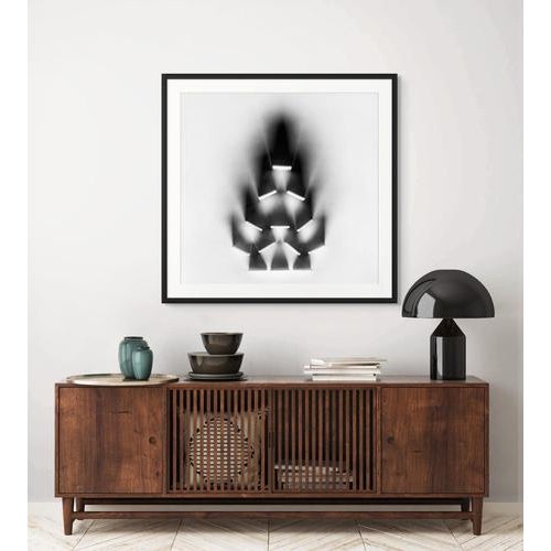 Inheritance of Shadow is a black and white abstract photograph by Ugnė Pouwell that explores transmission, repetition, and...