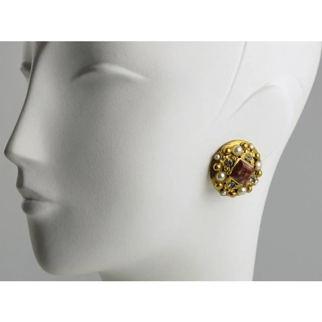 French Jewelry designer Henry Perichon (aka Henry) signed clip-on earrings. Gilt metal rounded shape in a Baroque design...