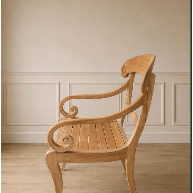 Bring timeless, artisanal character to your space with this striking vintage light-wood armchair. Perfectly balancing...