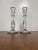 Pair of vintage clear glass candlestick holders, approximately 7.5” tall, with faceted hexagonal bases and decorative...