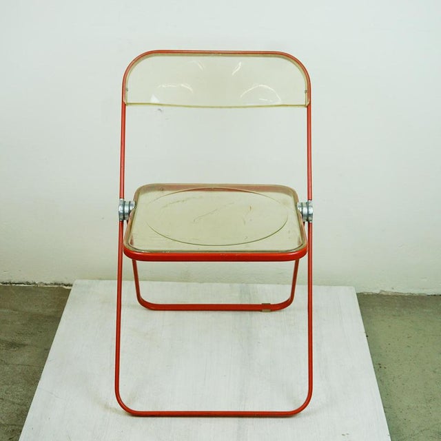 This iconic Italian Mid-Century Modern folding chair inacrylic glass and red lacquered aluminum were designed by Giancarlo...