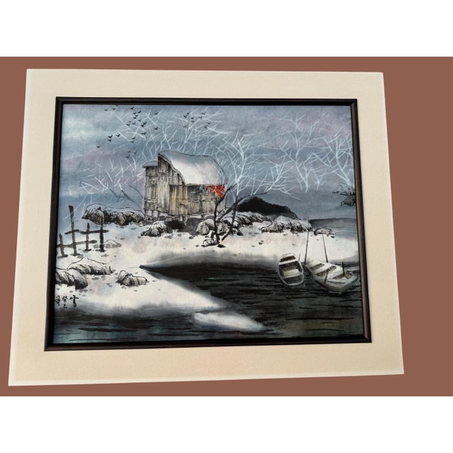 Original Watercolor and ink on paper painting of snow capped lake and barn. With frame it measures 29”wide, 25.25” tall...