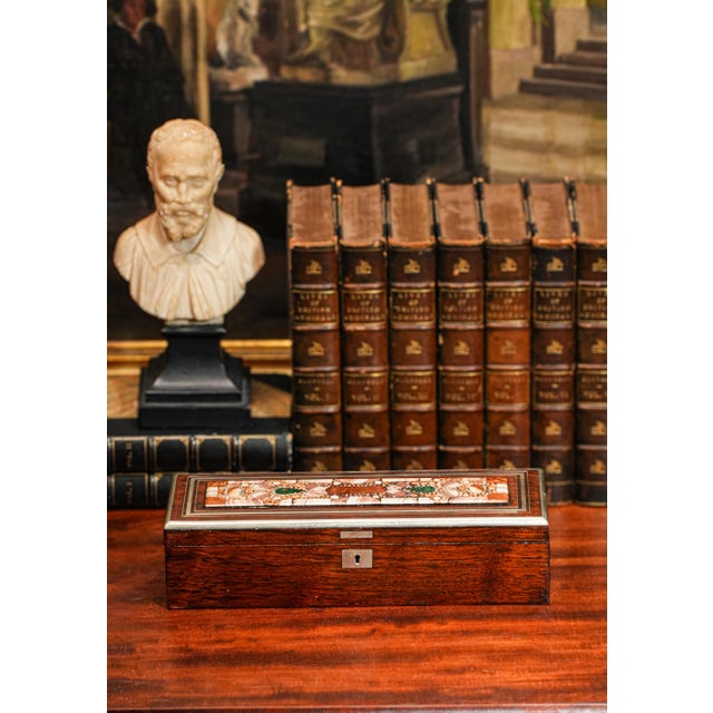 This exquisite handmade wood box is a captivating fusion of fine craftsmanship and timeless elegance, designed to impress...
