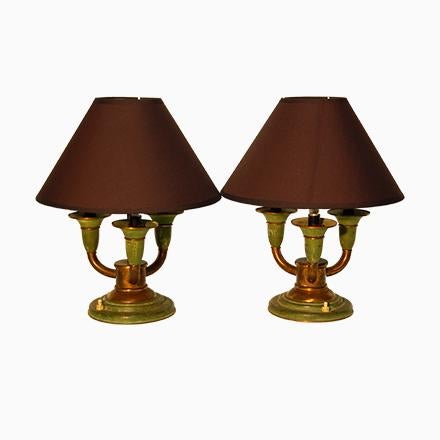 This Art Deco lamp is made of brass with green and gold patina. It has a circular base with three arms of light with...
