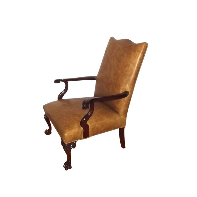 Stunning Antique English Gainsborough Style Library Armchair. This piece has incredible detail and design. It features a...