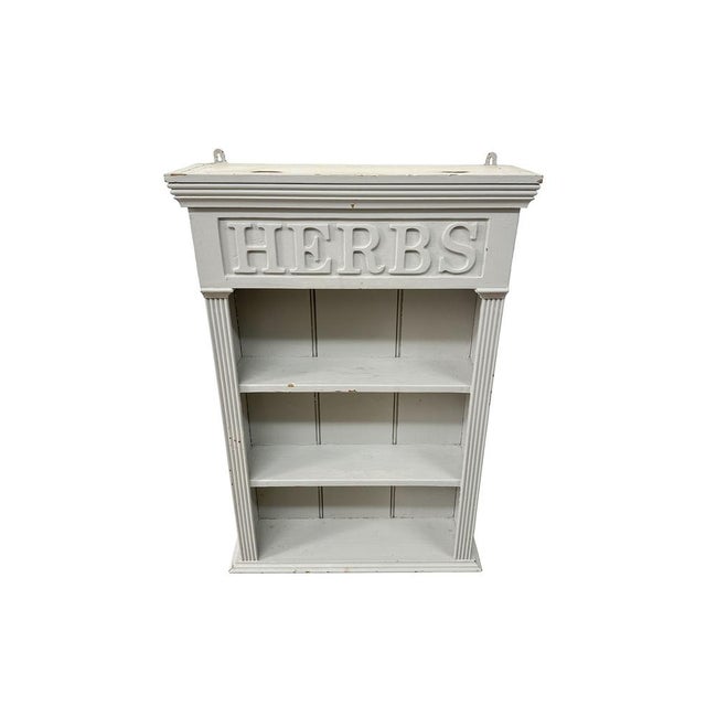 3 tier shelves with HERBS at the top. Nice detailing throughout and two screw hooks at the top to attach to a wall....