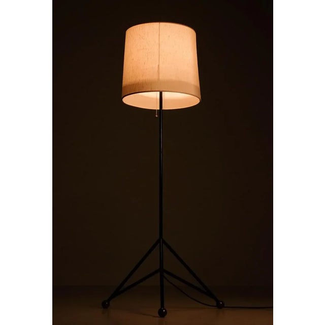 Swedish floor lamp, 1960s. Solid metal, tripod stand with brass feet. Good condition, with signs of usage, new wiring....