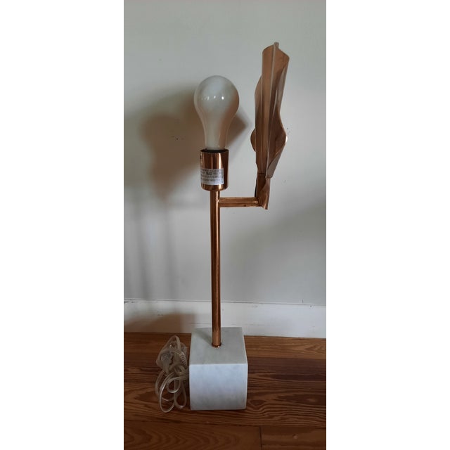 Market found, I love the modern organic nature of this scallop shaped metal fan floating with a socket behind to create...