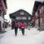 Setting Out by Toni Frissell Two skiers set out through snow covered streets, Klosters, Switzerland, 1951. (Photo by Toni...
