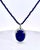 This stunning necklace features a striking lapis lazuli cabochon pendant, showcasing the gemstone's signature deep royal...
