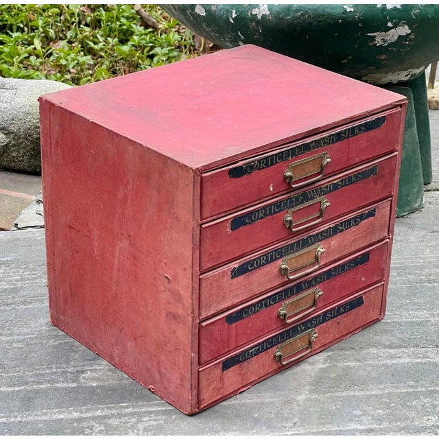 A beautiful and rare silk specimen cabinet Covered in red silk each drawer has a lid. Good vintage condition, with some...