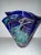 The Paul Bendzunas signed studio hand-blown art glass blue handkerchief vase from Georgia is a unique and decorative piece...