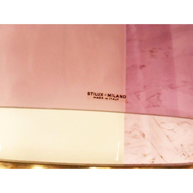 A rare set of four vintage Italian wall sconces designed by Oscar Torlasco for Stilux Milano, featuring frosted white...