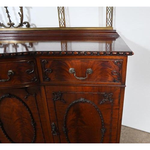 A gorgeous Victorian four door sideboard in the Chippendale manner Circa 1890 All in flame mahogany with extensive carving...