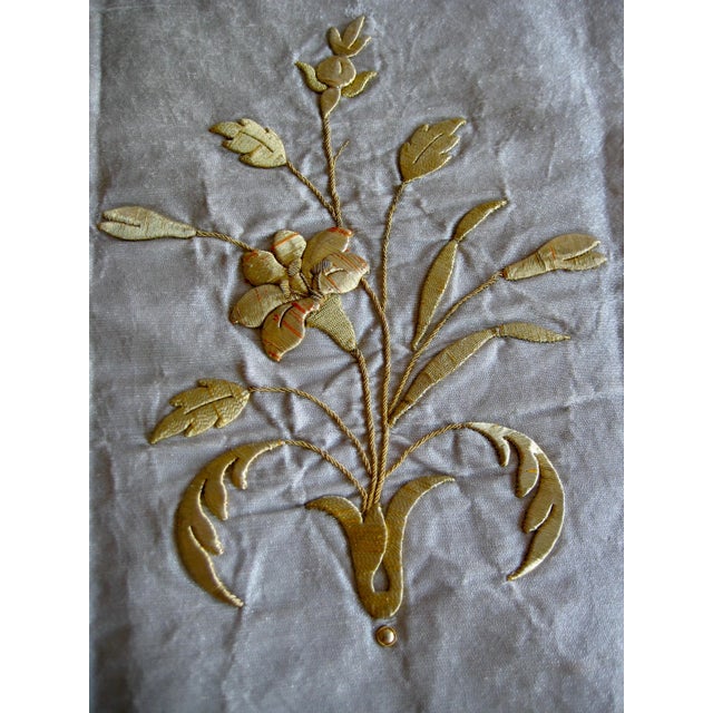 Beautiful metallic gold embroidery representing lily flowers tipical embroidery that would have been for churches on...