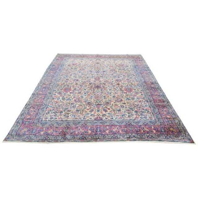 Hand-knotted with care using traditional rug-making techniques, this wool rug blends timeless craftsmanship with a modern...