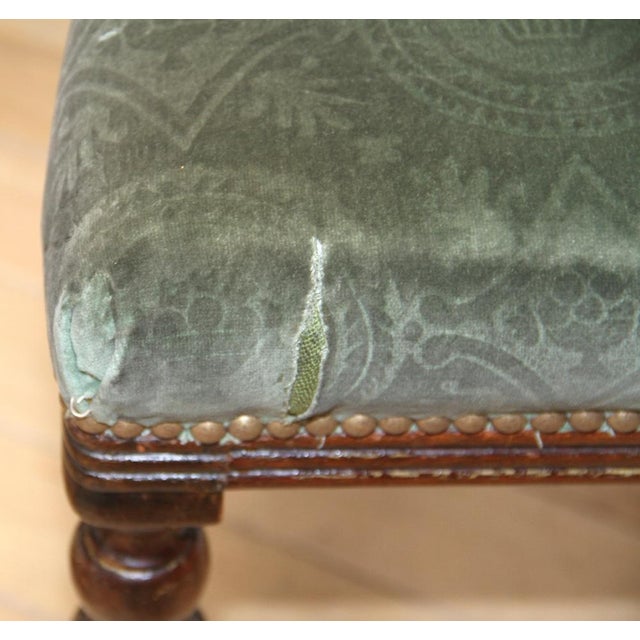 Suite of 3 vintage louis XVI style chairs. Dark wooden structure mahogany, carved and padded with green velvet with...