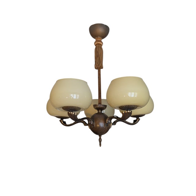Designed by Paavo Tynell, the 1373 pendant lamp from the 1930s embodies the designer's timeless design language and use of...