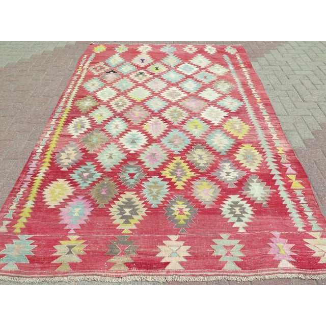 The Kilim Rug you are about to purchase is a Vintage Handmade Turkish Rug that is considered a collection piece due to its...