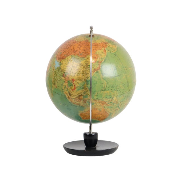 Beautiful vintage dutch-language globe on a round, black-lacquered oak base; published by hermann haack gotha for räth in...