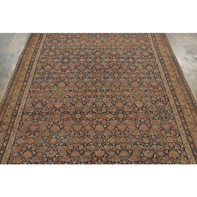 This 6x9 antique Persian Malayer rug, circa 1900–1920, hand-knotted in wool, is an eclectic addition to Rug & Kilim’s...