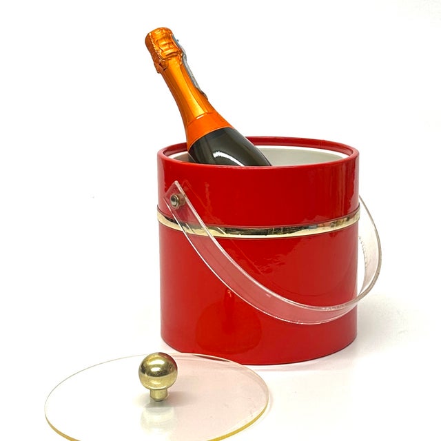 Red ice bucket. This is an eccentric fire truck-red vinyl ice bucket in a cylindrical shape with an acrylic transparent...