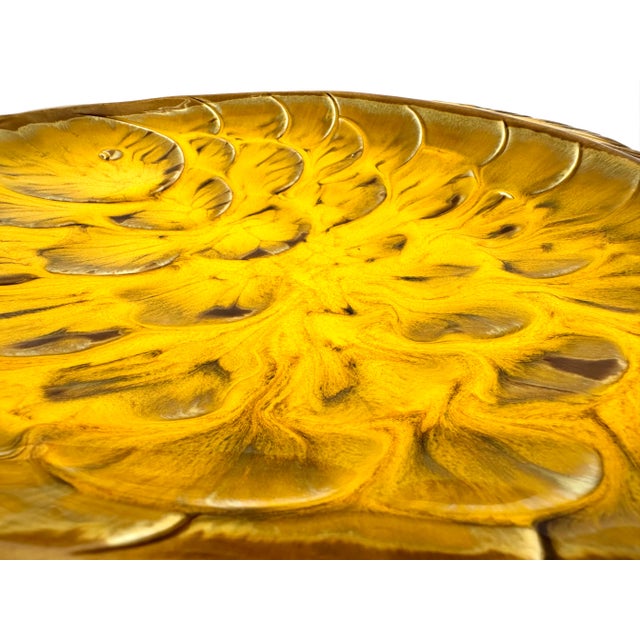 This is a beautiful Mid Century Modern burnt orange fish platter. It has the iconic hand painted unique California Pottery...