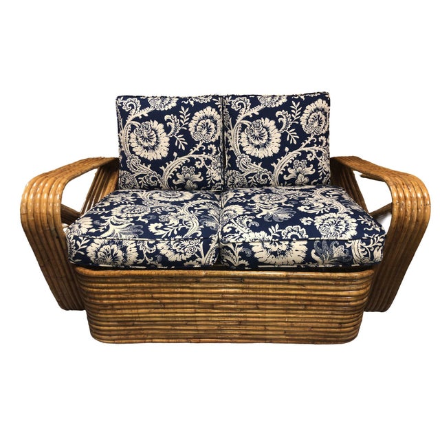 Refurbished rattan piece featuring six-strand double triangle arms, exuding charm with tortoiseshell rattan accents,...