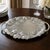 Lenox Grape Weave large-handled serving tray featuring raised grape clusters, leaves, vines, and a woven basket design....