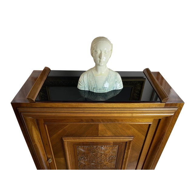 Antique sideboard / bar cabinet with an unusual base, floral carvings and a glass top as a storage area. Inside there are...