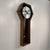 This is a rare Arthur Umanoff for Howard Miller #557 Coffin pendulum wall clock. It features a beautiful walnut frame with...