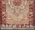 This vintage Turkish Oushak carpet (circa 1940) features a central blossoming medallion flower surrounded with smaller,...
