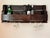 Handmade rustic oak wall-mounted wine holder rack in a high-gloss dark walnut stain. Has grooves for hanging six wine...