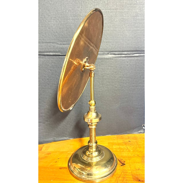 Late 19th-century English brass Vanity/Table Mirror with a polished, weighted pedestal base for stability. Features a...