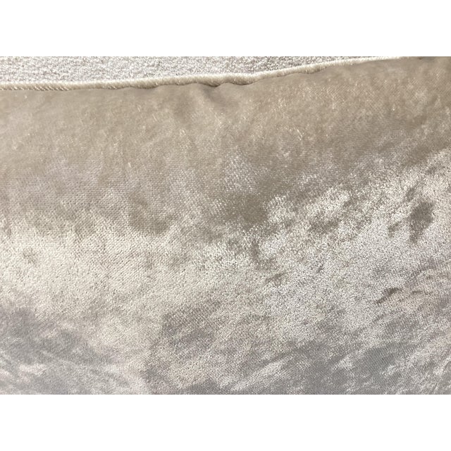 This pillow is made from a crushed velvet or embossed velvet fabric in a soft taupe tone. It is Chenille fabric. The...
